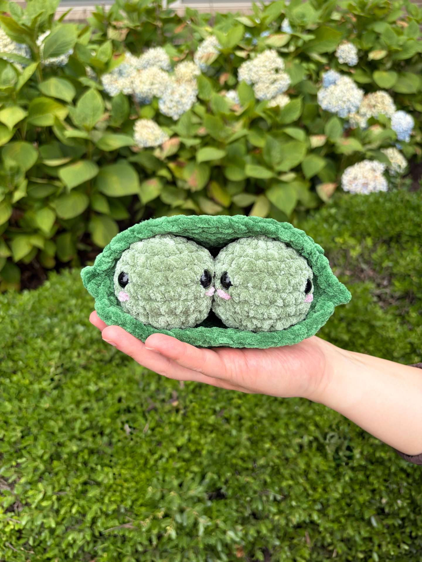 Crochet pea pod plushie made with chenille yarn